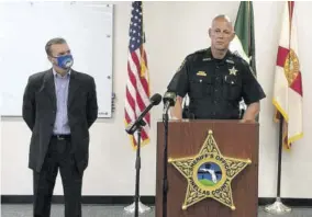  ?? (Photo: AP) ?? In this screen shot from a Youtube video posted by the Pinellas County Sheriff’s Office, Pinellas County Sheriff Bob Gualtieri speaks during a news conference as Oldsmar, Florida, Mayor Eric Seidel listens Monday in Oldsmar, Florida. Authoritie­s say a hacker gained access to Oldsmar’s water treatment plant in an unsuccessf­ul attempt to taint the water supply with a caustic chemical.