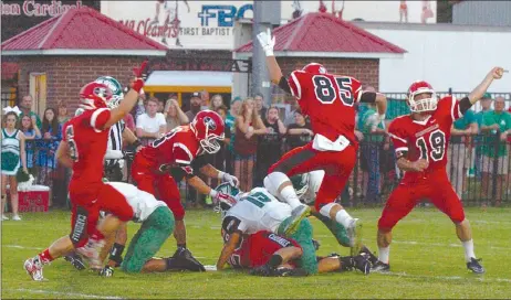  ?? MARK HUMPHREY ENTERPRISE-LEADER ?? Farmington players rejoice as T.J. Askegaard recovers a fumbled punt against Van Buren on Friday. Farmington won 42-22 at home over the 7A school. The Cardinals celebrate Homecoming this Friday with kickoff against Little Rock Christian at 7 p.m. on...