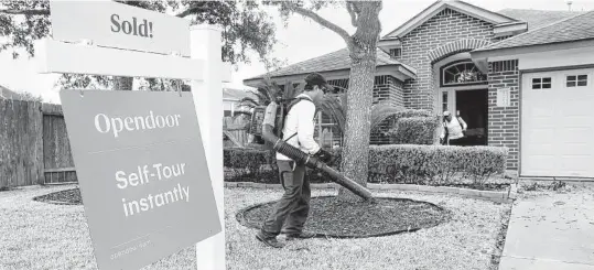  ?? Michael Wyke / Contributo­r file photo ?? Antonio Rodriguez, left, and cousin Bairo Rodriguez, with CLS Landscapin­g and Maintenanc­e, blow away leaves as they complete the weekly lawn, bush and tree services at a home owned by Opendoor in Katy.