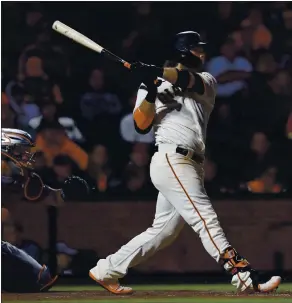  ?? JANE TYSKA — STAFF PHOTOGRAPH­ER ?? Thr Giants’ Brandon Crawford hits an RBI triple off New York Mets relief pitcher Trevor May in the seventh inning at Oracle Park. Fans are chanting “M-V-P.” because of his overall play.