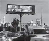  ?? Brian Vander Brug Los Angeles Times ?? CALTRANS message board reminds residents to conserve water during a severe, ongoing drought.