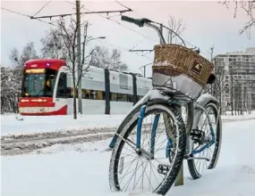  ?? — AFP ?? city cyclists may be put off by snow and rain but not necessaril­y everywhere.