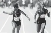  ?? STEPHEN M. DOWELL/STAFF PHOTOGRAPH­ER ?? St. Thomas Aquinas teammates Krystal Sparling, left, and Diamond Spaulding finish the 100-meter dash.