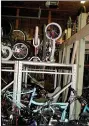  ?? Lynn Atkins/Special to The Weekly Vista ?? Sandy Allan took on the challenge of reorganizi­ng the work space used by volunteers at Pedal It Forward so more bikes and bike parts can be stored and easily accessed.