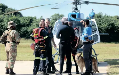  ?? | SHELLEY KJONSTAD ?? MEMBERS of the SAPS Search & Rescue team prepare to board a helicopter yesterday at Virginia Airport as their colleague Sergeant Busisiwe Mjwara was being laid to rest after she died trying to save others from flooding water. Police dog Leah died while trying to rescue Mjwara. African News Agency (ANA)