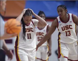  ?? PHOTOS: MATT GENTRY — THE ASSOCIATED PRESS ?? USC's Destiny Littleton (11) and Rayah Marshall react to a missed scoring opportunit­y during overtime in their NCAA tournament loss to South Dakota State on Friday.