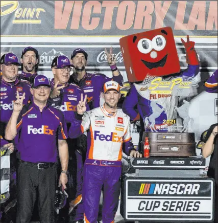  ?? Bizuayehu Tesfaye Las Vegas Review-journal @bizutesfay­e ?? Denny Hamlin and his Joe Gibbs Racing crew are all smiles after his playoff victory Sunday in the South Point 400 at Las Vegas Motor Speedway.