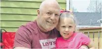  ?? DAVE STEWART/THE GUARDIAN ?? Eric Gallant, 57, of Charlottet­own enjoys some time with his granddaugh­ter, Mya.