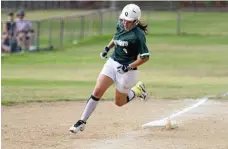  ?? PHOTO: KEVIN FARMER ?? SCOUTED: Monique Smith makes a home run for Warriors White against Dodgers.