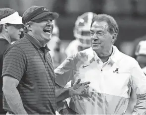  ?? ?? Georgia coach Kirby Smart speaks with Alabama coach Nick Saban before the SEC championsh­ip game Dec. 4 in Atlanta.