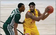  ?? MICHAEL CONROY — THE ASSOCIATED PRESS ?? Maryland forward Donta Scott is defended by Michigan State forward Marcus Bingham Jr. in the second half of the Big Ten Conference tournament in Indianapol­is, March 11.