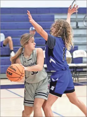  ?? Danielle Pickett, General Photograph­y ?? Heritage’s Addyson Morrison draws defensive coverage from Rossville’s Ember Ivester during a game this past Thursday in Boynton.