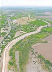  ?? REUTERS FILE ?? A levee, which acts as a border wall, is pictured in the Rio Grande Valley near Mcallen, Texas.