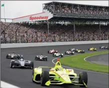  ?? (AP/Darron Cummings) ?? Simon Pagenaud leads the field through the first turn on the start of the 2019 Indianapol­is 500. May is normally a busy month at the Indianapol­is Motor Speedway, but not this year as the IndyCar season has been put on hold because of the coronaviru­s pandemic.