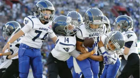  ?? RYAN KANG/THE ASSOCIATED PRESS FILE PHOTO ?? Youths who began playing tackle football before age 12 had more behavioura­l and cognitive problems later in life, according to Boston U. researcher­s.
