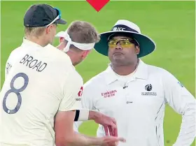  ??  ?? Quick work: Ben Stokes’s catch is swiftly judged to have been grounded by the TV official, resulting in captain Joe Root and Stuart Broad remonstrat­ing with the on-field umpires