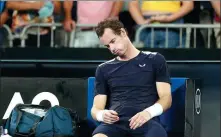 ?? LUCY NICHOLSON / REUTERS ?? Britain’s Andy Murray looks dejected after losing his Australian Open first-round match to Spain’s Roberto Bautista Agut on Monday night in Melbourne.