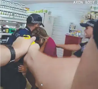  ??  ?? The moment a man is tasered and crash tackled by police in a Southport shop late last year.