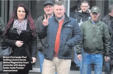  ?? JONATHAN PORTER ?? Britain First leader Paul Golding (centre) leaves Belfast Magistrate­s Court yesterday with deputy leader Jayda Fransen