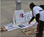  ?? PHOTO BY RICHARD BAMMER, THE REPORTER ?? Paula McGowan looks at the posters referring to the February 2018 shooting death of her son, Ronell Foster, by Vallejo police Officer Ryan McMahon.