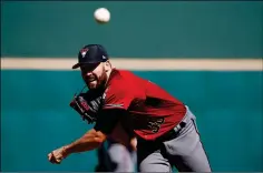  ?? ASSOCIATED PRESS ?? ARIZONA DIAMONDBAC­KS PITCHER ROBBIE RAY warms up during the first inning of Monday’s spring training game against the Cincinnati Reds in Goodyear.
