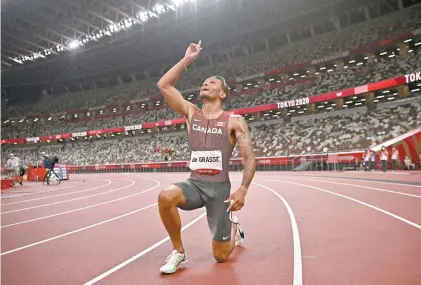  ?? BEN STANSALL AGENCE FRANCE-PRESSE ?? En plus de porter à cinq le total de ses médailles olympiques, le coureur ontarien a inscrit un nouveau record canadien de 19,62 secondes.