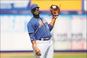  ?? Julio Cortez / Associated Press ?? Mets 2B Robinson Cano has been keeping busy during social distancing by working out, distributi­ng food and catching up with former major leaguers and teammates over Zoom.