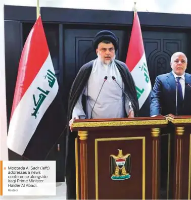  ?? Reuters ?? Moqtada Al Sadr (left) addresses a news conference alongside Iraqi Prime Minister Haider Al Abadi.