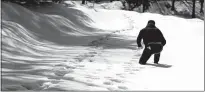  ?? Brian van der Brug
/ Los Angelestim­es ?? A volunteer postholes through deep snow as he checks on area residents on March 7 in Crestline, California.