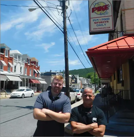  ?? WES CIPOLLA - MEDIANEWS GROUP PHOTO ?? Mike Pullano, right, owner of the Pike Café in Reading with Kyle Riggs, left, co-owner of Paradise by the Slice in Wernersvil­le at the Pike Café. Pullano plans to sell the Pike Café and Shirley’s Café and Tequila Bar in Laureldale to Riggs. The sale is expected to close this summer.