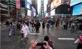  ??  ?? ‘[Saying you’re vaccinated] doesn’t obviate the need for distance or masks, but it does at least take the edge off things’ – New York City’s Times Square. Photograph: Anadolu Agency/ Getty Images