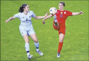  ?? Francois Mori The Associated Press ?? Carli Lloyd of the U.S., right, vies for the ball with Thailand’s Miranda Nild on Tuesday in Reims, France. Lloyd had a hat trick in the Americans’ victory in the World Cup final in 2015, but is pegged as a substitute for this World Cup at age 36.
