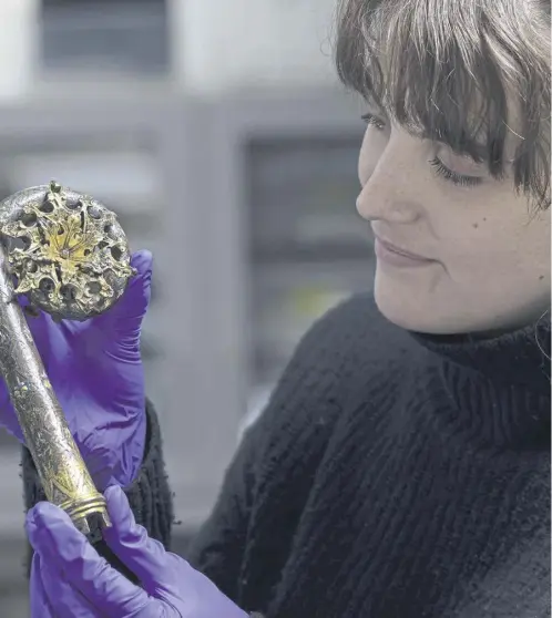  ?? ?? NMS conservati­on student Olivia Hope with the 12th century bishop’s crozier