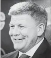  ?? JEFF MCINTOSH THE CANADIAN PRESS ?? New Flames head coach Bill Peters speaks to the media in Calgary on Monday.
