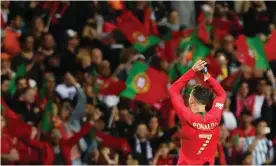  ?? Photograph: Paulo Novais/EPA ?? Cristiano Ronaldo celebrates with fans after Portugal’s 1-0 win over the Netherland­s in the Nations League final in Porto.