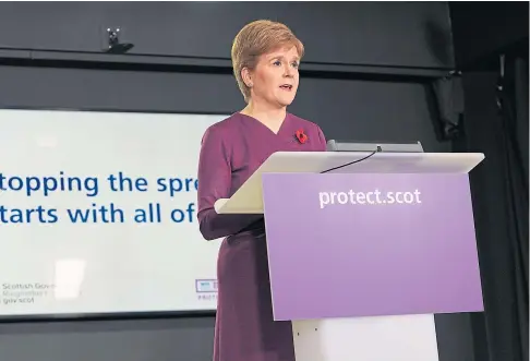  ??  ?? PROGRESS: Nicola Sturgeon said restrictio­ns imposed in Scotland had “significan­tly” slowed the spread of the virus.