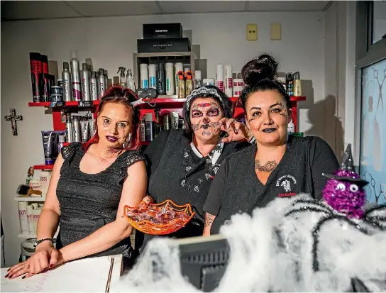  ?? PHOTO: SIMON O’CONNOR/STUFF ?? The Halloween spirit was on show at the Bell Block Barbers yesterday, left to right: barber Ani Manukonga, barbershop owner Tanz Johns and barber Jaide Whiteman.