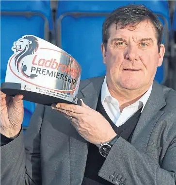  ??  ?? Award-winner Tommy Wright celebrates 250 games in charge of Saints tonight. SNS.