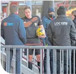  ??  ?? Referee Chris Graham speaks to club staff after abandoning the game at Ochilview