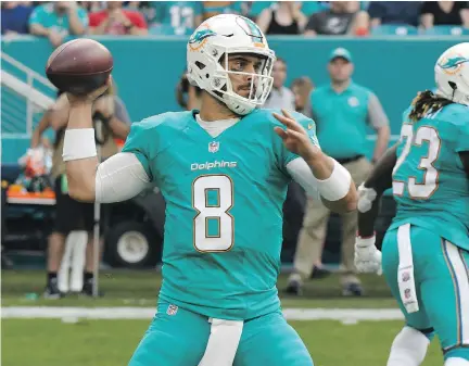  ?? ERIC ESPADA/GETTY IMAGES FILES ?? The playoff fortunes of the Miami Dolphins rest with backup quarterbac­k Matt Moore, pressed into service with the injury to starter Ryan Tannehill on Dec. 11. The Dolphins will take on the Pittsburgh Steelers in one of the AFC wild-card games Sunday.