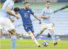  ?? (Photo: AFP) ?? Chelsea’s Moroccan midfielder Hakim Ziyech (centre) shoots to score their first goal during the English Premier League match against Manchester City at Etihad Stadium in Manchester, north west England, yesterday.