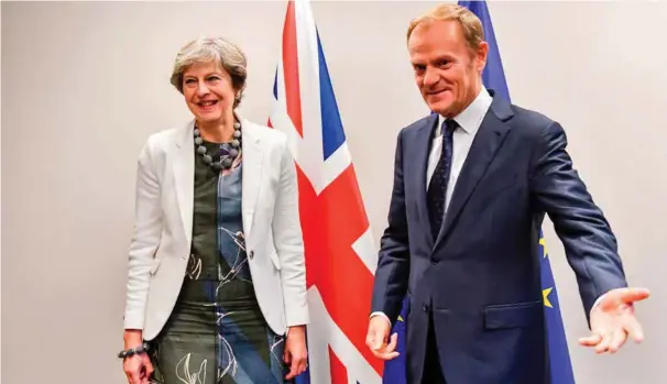  ?? FOTO: NTB SCANPIX ?? Storbritan­nias statsminis­ter Theresa May og Eu-presiden Donald Tusk poserer foran gårsdagens Eu-toppmøte i Brussel.