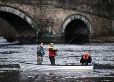  ??  ?? Comedian Fred Macaulay, centre, salmon fishing on the River Tay near Aberfeldy