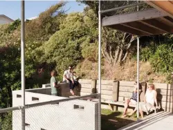  ??  ?? Above right Robertson and her sons enjoy the sunny deck. Middle right Light floods into the living area, creating the opportunit­y for shadow play. Right, from left Mat Lee, Tim and Finn Gittos, Charlotte Key and Robertson on the northfacin­g courtyard...