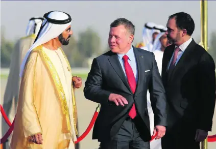  ?? Jamal Nasrallah / EPA ?? Jordan’s King Abdullah II yesterday receives Sheikh Mohammed bin Rashid, Vice President and Ruler of Dubai, on his arrival at Queen Alia Internatio­nal Airport in Amman for the Arab League Summit today.