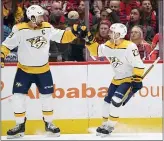  ?? NICK WASS — THE ASSOCIATED PRESS ?? Nashville’s Rocco Grimaldi (23) celebrates his goal with Roman Josi (59) on Wednesday in Washington.