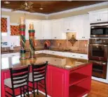  ??  ?? The spacious kitchen is   tted with painted cabinetry, granite counters and stainless-steel appliances.