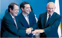  ?? (Alexandros Avramidis/Reuters) ?? PRIME MINISTER Benjamin Netanyahu (from right) shakes hands with Greek Prime Minister Alexis Tsipras and Cypriot President Nicos Anastasiad­es in Thessaloni­ki, Greece, last June.