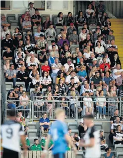  ??  ?? Mixed messages: Fans at Kilcoo’s clash with Mayobridge