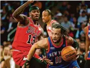  ?? John Munson/Associated Press ?? New York Knicks guard Jalen Brunson (11) dribbles around Chicago Bulls forward Torrey Craig during the first half Sunday in New York.